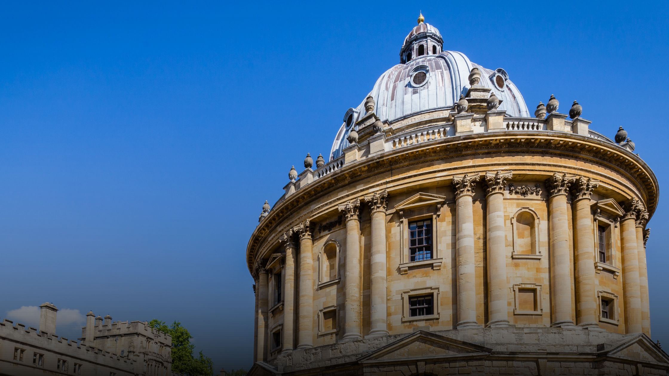 The Radcliffe Camera in Oxford under a clear blue sky on a hot summer day